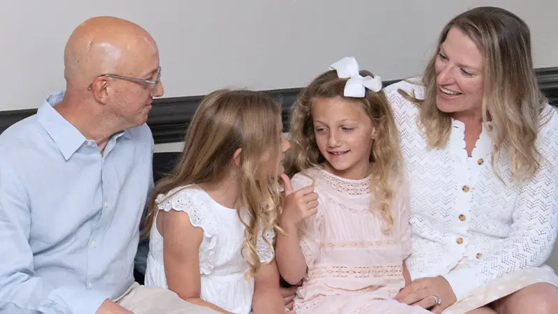 Happy family waiting to see dentist in lobby