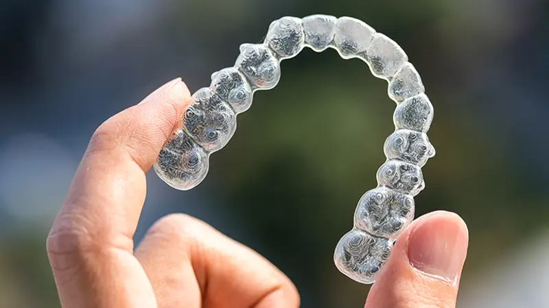close up of invisalign product against natural background