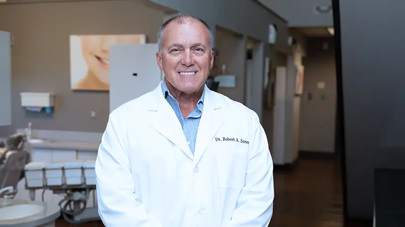 Dr. Robert Sorenson, DDS standing in office